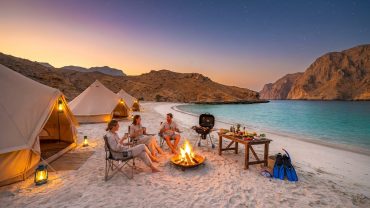 Camping in Musandam on a peaceful beach surrounded by mountains and turquoise waters in Khasab, Oman